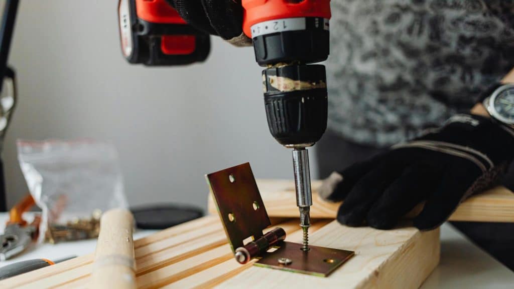 Cordless Drill installing a hinge