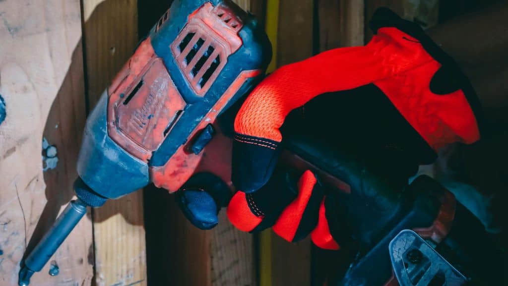 Cordless Drill in hand with glove